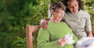 An image of a caregiver helping an elder with daily tasks in a Senior Home Care franchise in Kentucky.